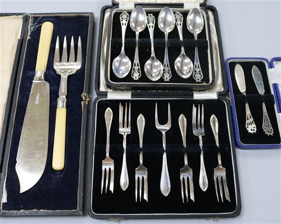 Four assorted cased sets of silver cutlery including teaspoons and fish servers.